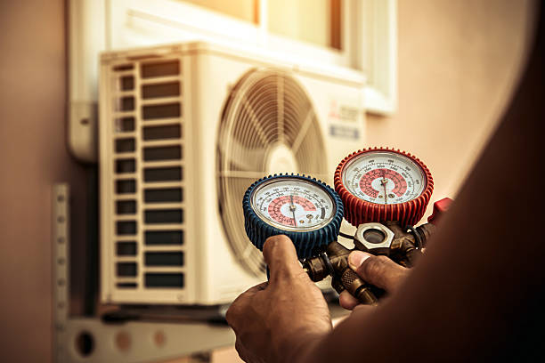 Professional Air Conditioning Service technician working in Auburn, MA